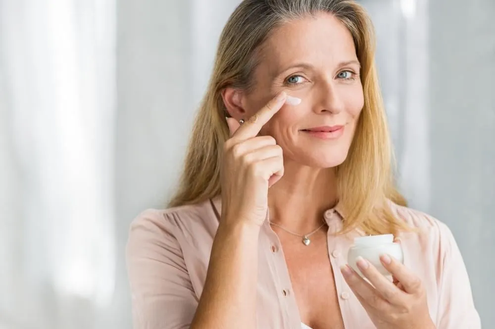 Woman Applying Eye Cream